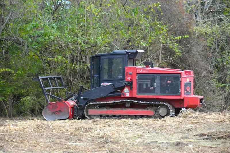 Tracked forestry mulcher clearing brush on a Texas property